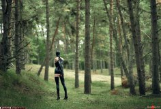 Spring casually exploring the woods in her custom-made very extreme bondage outfit.
