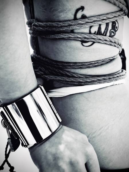 Kinbaku waitress in shiny metal